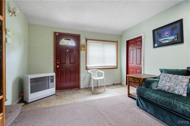 9748-9736 Podunk Rd, Lee, NY 13363 - foyer entrance with heating unit, a textured ceiling, and baseboards