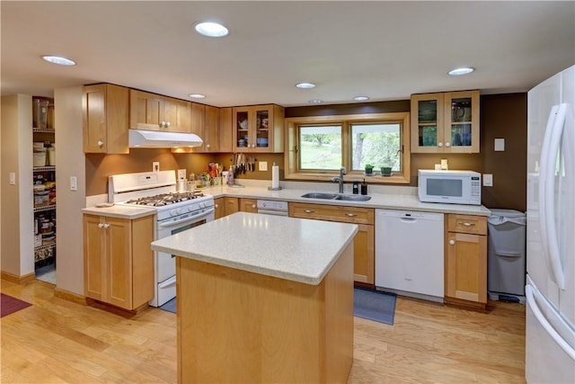 161 Bell Hill Rd, New Lisbon, NY 13342 - kitchen with white appliances, a sink, under cabinet range hood, light countertops, and a center island