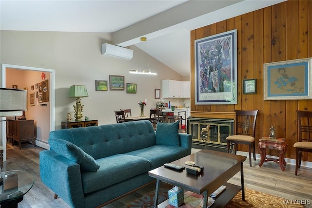 454 Kenwood Dr, Lewiston, NY 14092 - living area featuring a wall unit AC, wooden walls, wood finished floors, a chandelier, and a baseboard radiator