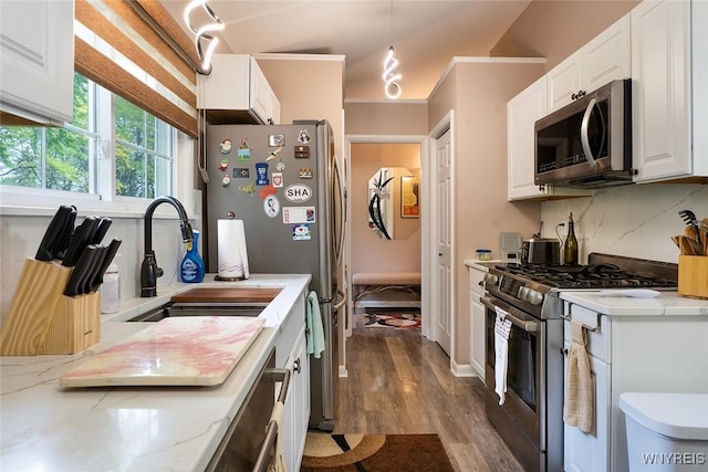 454 Kenwood Dr, Lewiston, NY 14092 - kitchen with stainless steel appliances, dark wood-type flooring, white cabinets, a sink, and light stone countertops