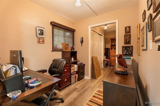 454 Kenwood Dr, Lewiston, NY 14092 - office space with light wood-style flooring and a baseboard heating unit