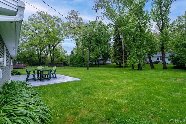 454 Kenwood Dr, Lewiston, NY 14092 - view of grassy yard featuring a patio