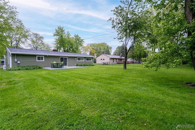 454 Kenwood Dr, Lewiston, NY 14092 - view of grassy yard featuring a patio