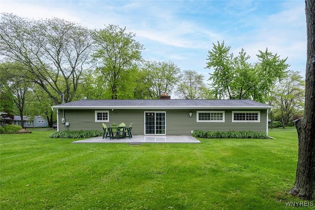 454 Kenwood Dr, Lewiston, NY 14092 - back of property with a patio area, a lawn, and a chimney