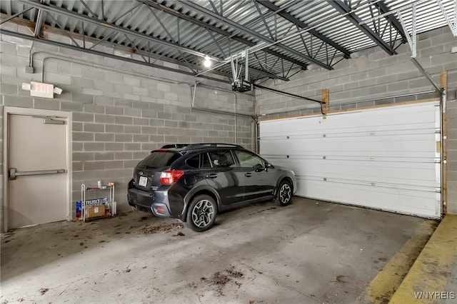849 Delaware Ave Unit 204, Buffalo, NY 14209 - parking deck with a garage door opener and concrete block wall