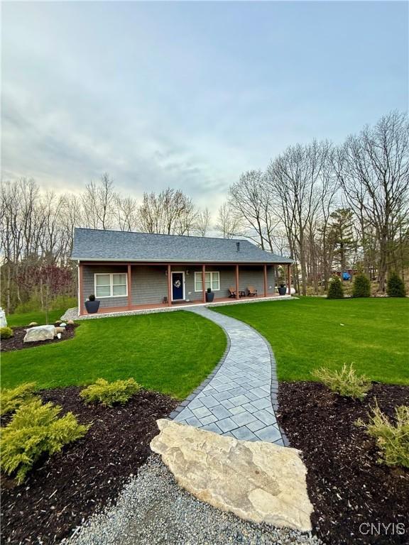 26633 Kring Point Rd, Alexandria, NY 13679 - view of front of property with a front lawn and a porch