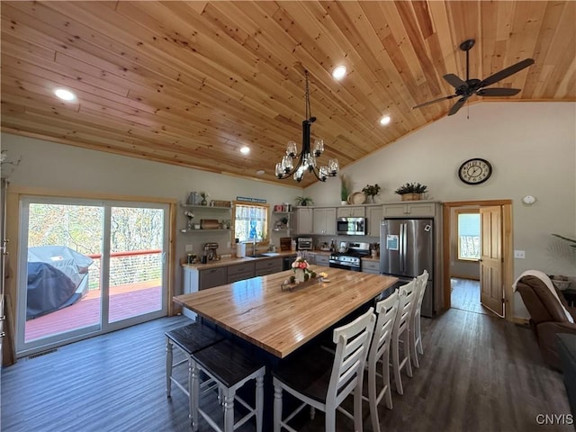 26633 Kring Point Rd, Alexandria, NY 13679 - dining room with wooden ceiling, dark wood-style floors, a chandelier, ceiling fan, and recessed lighting