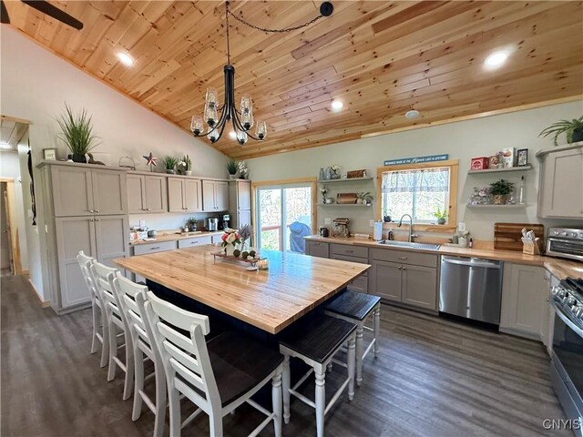 26633 Kring Point Rd, Alexandria, NY 13679 - kitchen with stainless steel appliances, open shelves, a sink, butcher block counters, and wooden ceiling