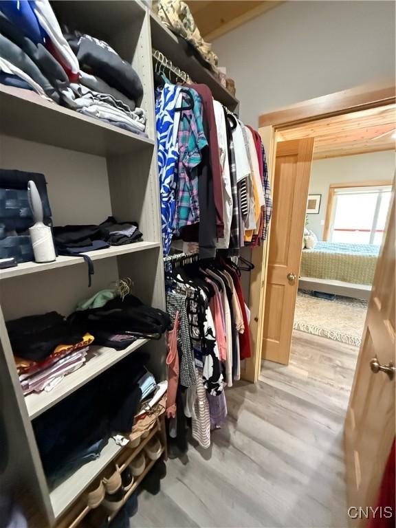 26633 Kring Point Rd, Alexandria, NY 13679 - walk in closet with wood finished floors