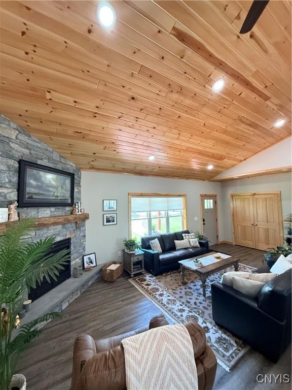 26633 Kring Point Rd, Alexandria, NY 13679 - living room featuring wood ceiling, lofted ceiling, a stone fireplace, wood finished floors, and recessed lighting