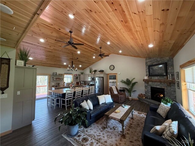 26633 Kring Point Rd, Alexandria, NY 13679 - living room featuring dark wood-style floors, wood ceiling, lofted ceiling, a ceiling fan, and a fireplace