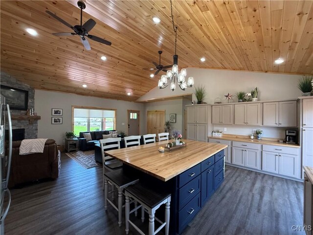 26633 Kring Point Rd, Alexandria, NY 13679 - kitchen with butcher block counters, wood ceiling, ceiling fan, open floor plan, and vaulted ceiling