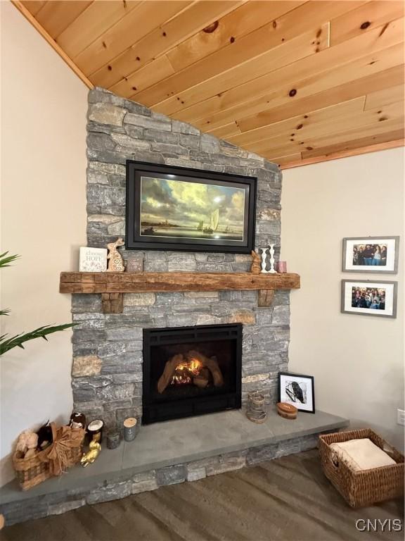 26633 Kring Point Rd, Alexandria, NY 13679 - detailed view of wood ceiling, a stone fireplace, and wood finished floors