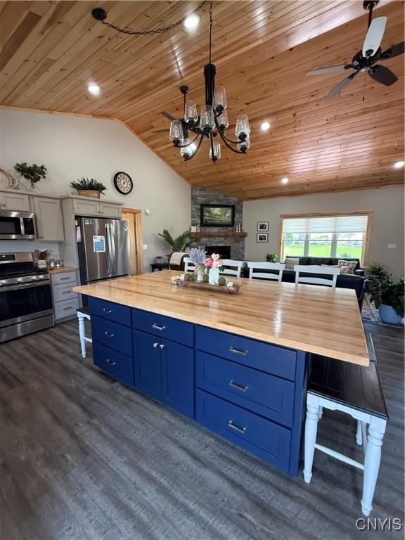 26633 Kring Point Rd, Alexandria, NY 13679 - kitchen with stainless steel appliances, wooden ceiling, blue cabinets, vaulted ceiling, and wooden counters