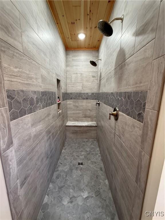 26633 Kring Point Rd, Alexandria, NY 13679 - bathroom featuring tiled shower and wood ceiling