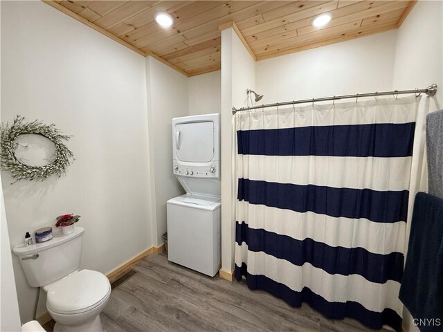 26633 Kring Point Rd, Alexandria, NY 13679 - bathroom featuring stacked washer and clothes dryer, wood ceiling, recessed lighting, toilet, and wood finished floors