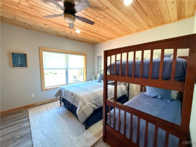 26633 Kring Point Rd, Alexandria, NY 13679 - bedroom with wood ceiling, baseboards, wood finished floors, and a ceiling fan
