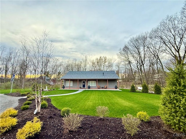 26633 Kring Point Rd, Alexandria, NY 13679 - back of house with a porch, a yard, and roof with shingles