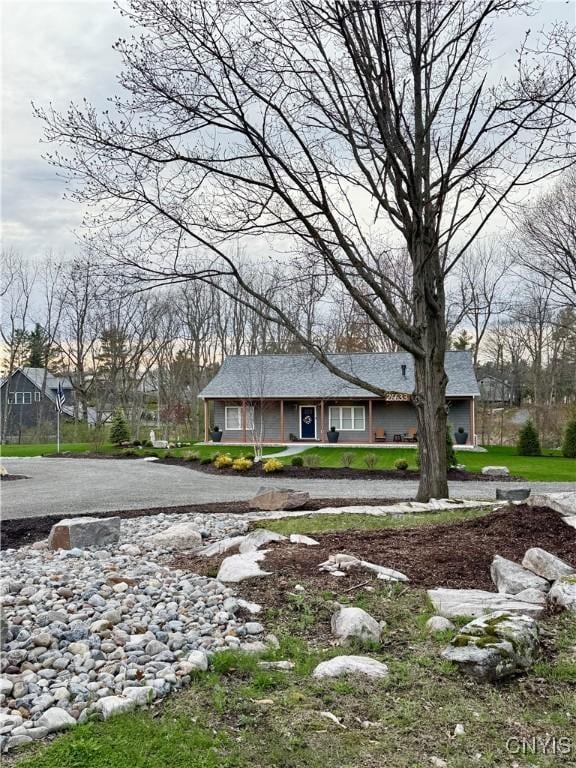26633 Kring Point Rd, Alexandria, NY 13679 - view of front facade with a porch