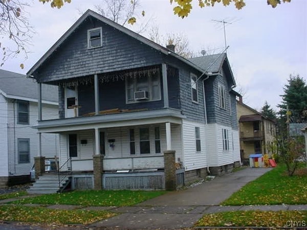 100-102 Lowell Ave Unit 102, Utica, NY 13502 - view of front facade with a porch and cooling unit