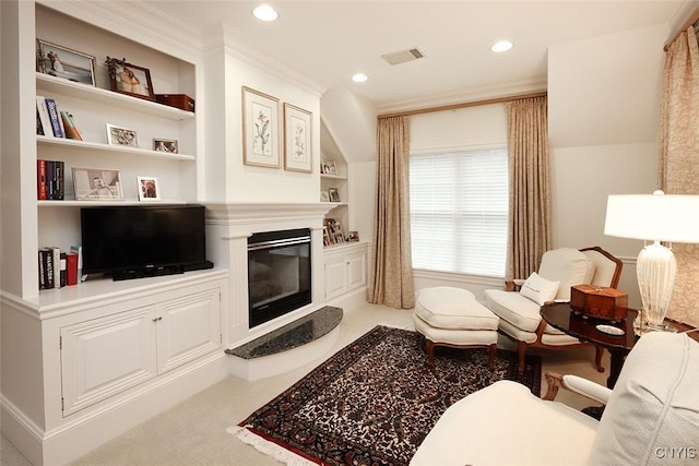 7106 Braxton Cir, Dewitt, NY 13066 - living area with built in features, a glass covered fireplace, crown molding, and recessed lighting