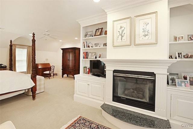 7106 Braxton Cir, Dewitt, NY 13066 - bedroom featuring light colored carpet, a glass covered fireplace, ornamental molding, and recessed lighting