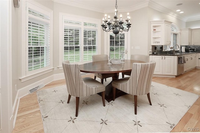 7106 Braxton Cir, Dewitt, NY 13066 - dining room with a chandelier, ornamental molding, light wood-style flooring, plenty of natural light, and recessed lighting