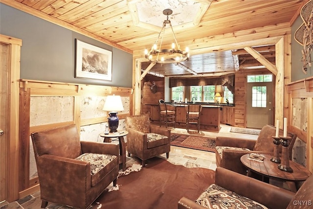 7106 Braxton Cir, Dewitt, NY 13066 - living area with a chandelier, wood walls, wooden ceiling, crown molding, and stone finish flooring
