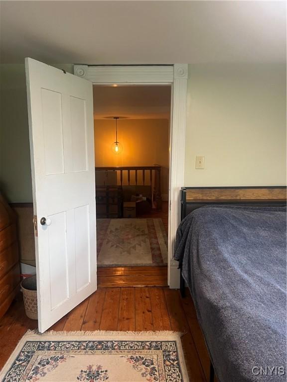 6265 Haslauer Rd, Stockbridge, NY 13409 - bedroom featuring wood-type flooring