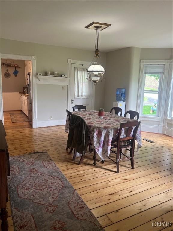 6265 Haslauer Rd, Stockbridge, NY 13409 - dining space with light wood-type flooring and baseboards