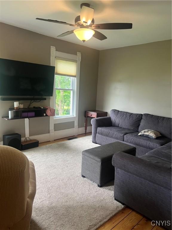 6265 Haslauer Rd, Stockbridge, NY 13409 - living area with a ceiling fan and wood finished floors