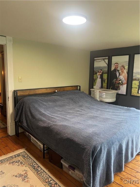 6265 Haslauer Rd, Stockbridge, NY 13409 - bedroom featuring wood-type flooring