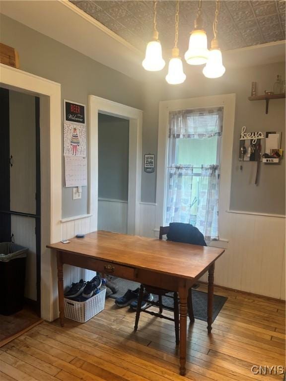 6265 Haslauer Rd, Stockbridge, NY 13409 - dining room with an ornate ceiling, hardwood / wood-style flooring, a chandelier, and a wainscoted wall