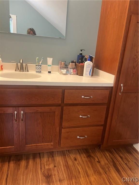 6265 Haslauer Rd, Stockbridge, NY 13409 - bathroom featuring vanity and wood finished floors