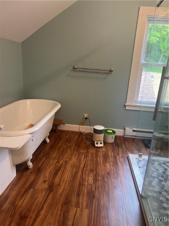 6265 Haslauer Rd, Stockbridge, NY 13409 - full bathroom with wood finished floors, a freestanding bath, baseboards, a baseboard heating unit, and a shower