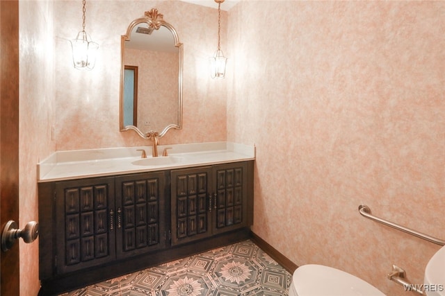 126 Crestwood Ln, Amherst, NY 14221 - half bathroom with toilet, vanity, and wallpapered walls