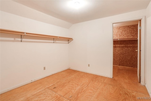126 Crestwood Ln, Amherst, NY 14221 - walk in closet featuring lofted ceiling and light wood-style flooring