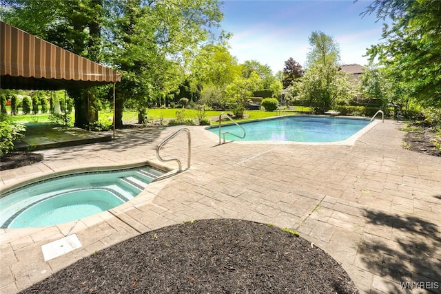 126 Crestwood Ln, Amherst, NY 14221 - outdoor pool with an in-ground hot tub, a patio, view of wooded area, and a yard