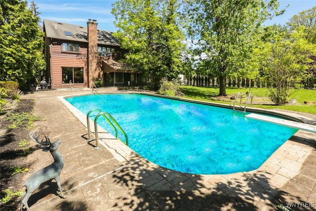 126 Crestwood Ln, Amherst, NY 14221 - outdoor pool featuring a patio area and a diving board
