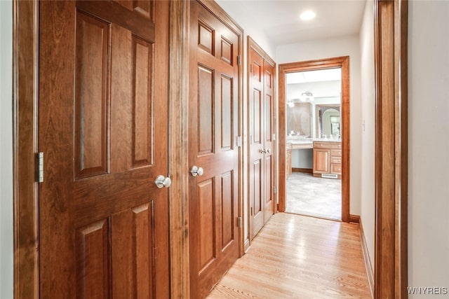 126 Crestwood Ln, Amherst, NY 14221 - hallway featuring light wood finished floors, baseboards, and recessed lighting