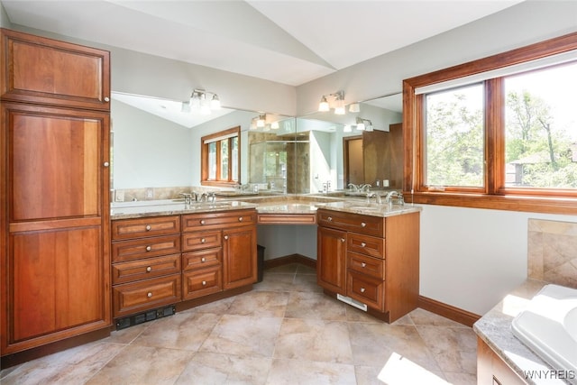 126 Crestwood Ln, Amherst, NY 14221 - full bath featuring lofted ceiling, double vanity, healthy amount of natural light, a garden tub, and tile patterned floors