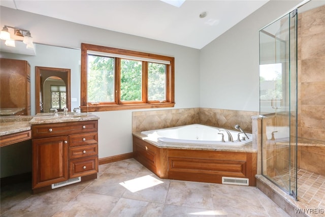126 Crestwood Ln, Amherst, NY 14221 - full bathroom featuring vanity, a jetted tub, a stall shower, and vaulted ceiling