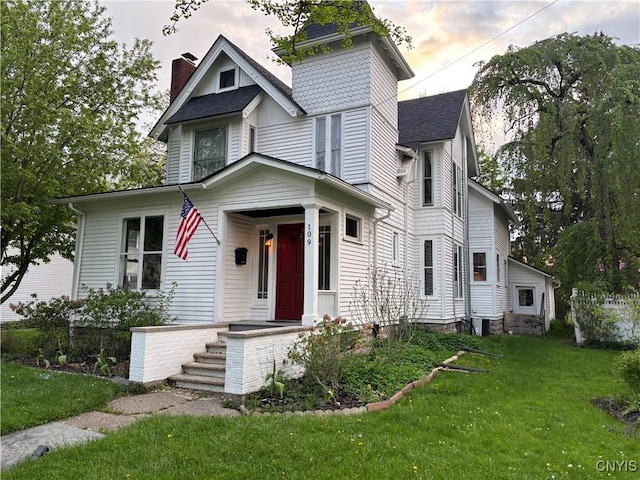 109 State St, Seneca Falls, NY 13148 - victorian home with a chimney, a front lawn, and roof with shingles