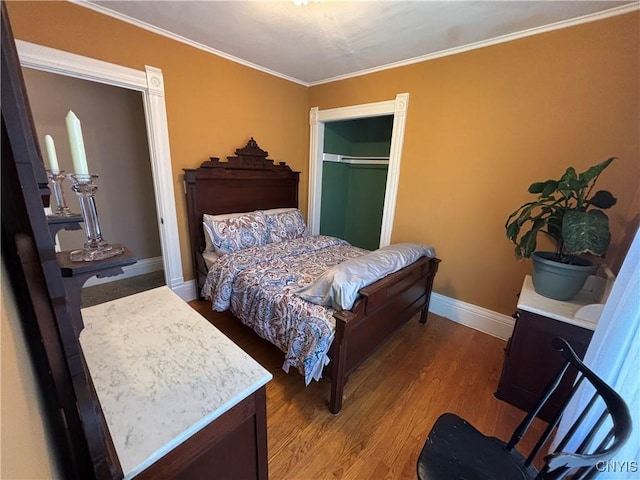 109 State St, Seneca Falls, NY 13148 - bedroom with wood finished floors, baseboards, crown molding, and a closet