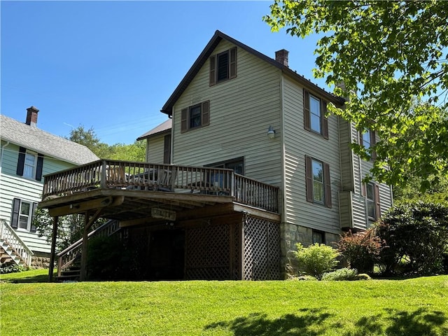 21 Curtis Rd, Hamilton, PA 16333 - back of property with a deck, stairway, a chimney, and a yard