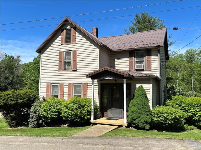 21 Curtis Rd, Hamilton, PA 16333 - traditional-style house with metal roof, a chimney, and cooling unit