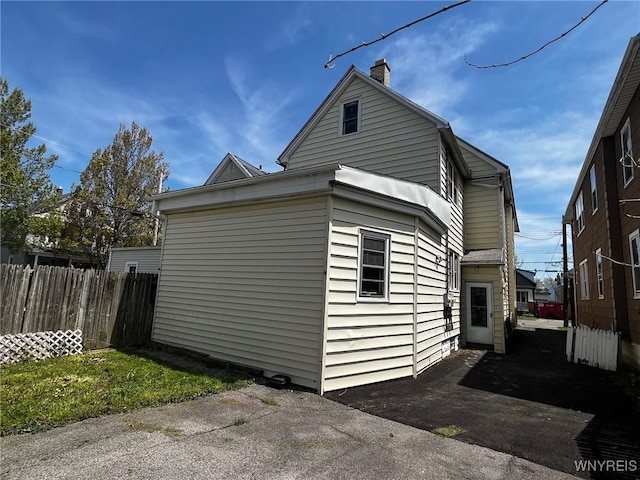 228 Weiss St, Buffalo, NY 14206 - view of home's exterior with a chimney