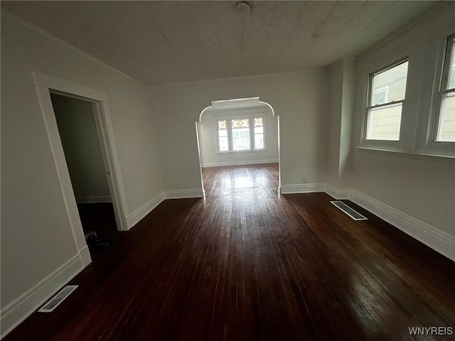 228 Weiss St, Buffalo, NY 14206 - spare room with arched walkways, dark wood finished floors, ornamental molding, and baseboards