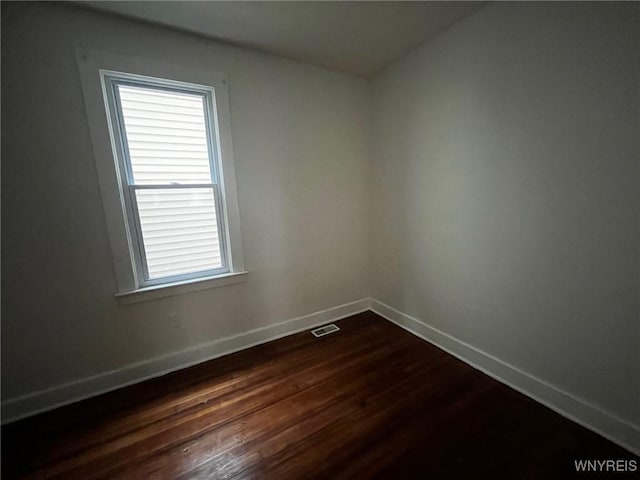 228 Weiss St, Buffalo, NY 14206 - spare room featuring baseboards and dark wood-type flooring