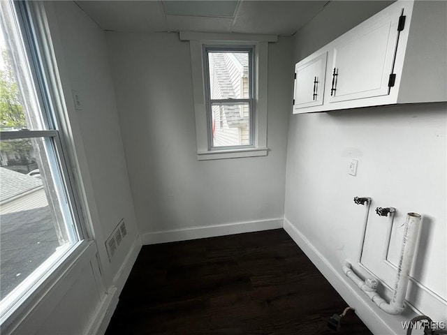 228 Weiss St, Buffalo, NY 14206 - laundry area with dark wood-style floors and baseboards